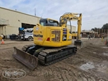 Back of used excavator in yard